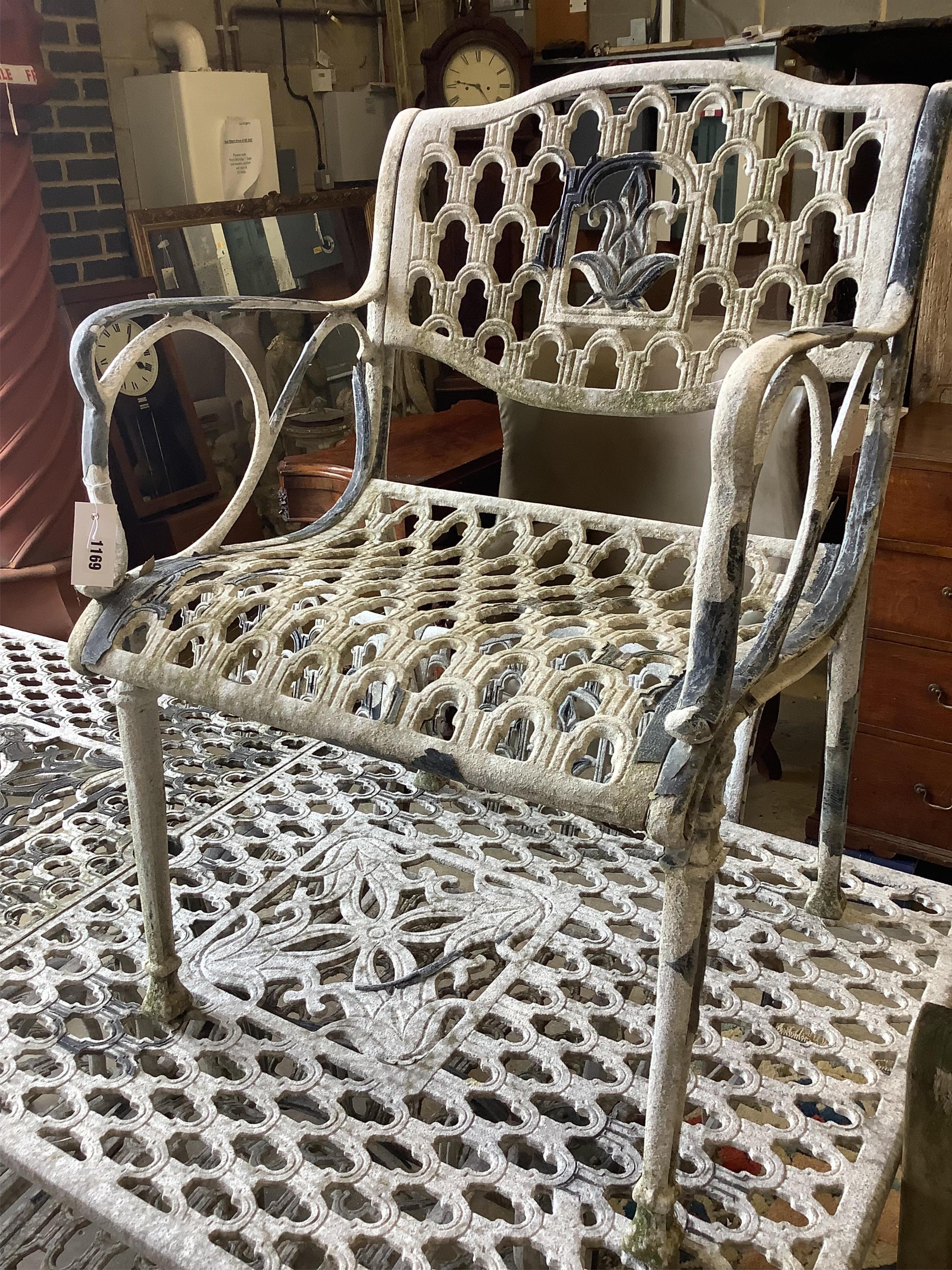 A rectangular painted aluminium garden table, width 177cm, depth 80cm, height 73cm, five matching elbow chairs and bench